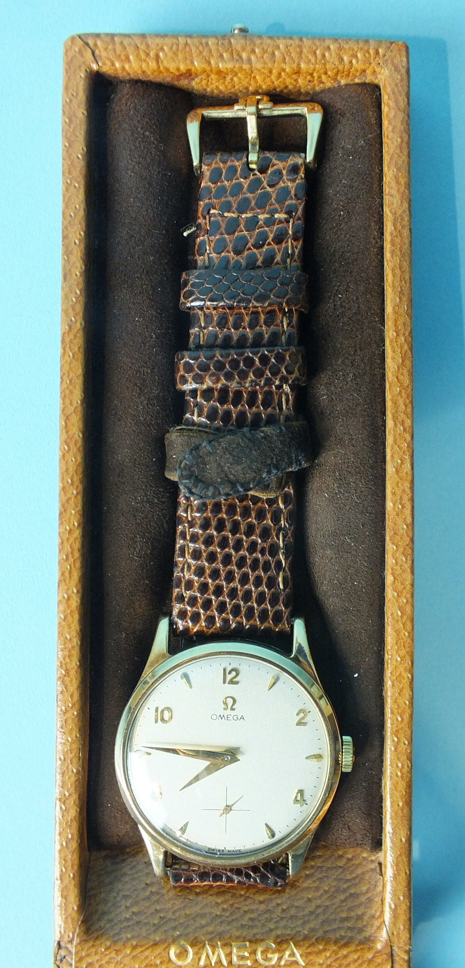 Omega, a gent's 9ct-gold-cased wrist watch c1950's, the silvered dial with Arabic even and dart