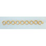 A 14ct yellow gold bracelet of alternate textured circular and plain oval links, maker's mark '