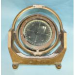 A large bronze ships compass in gimbal-mounted stand, labelled "Gyro Compass Synchronous Bearing