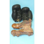 A pair of black leather boxing gloves labelled 'Frank Bryan Ltd, London' and an early pair of