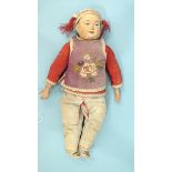 A late 19th/early 20th century Japanese boy doll with moulded and painted plaster and wood head on