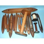 A collection of weaving shuttles, 38cm-79cm and three spools, (17).