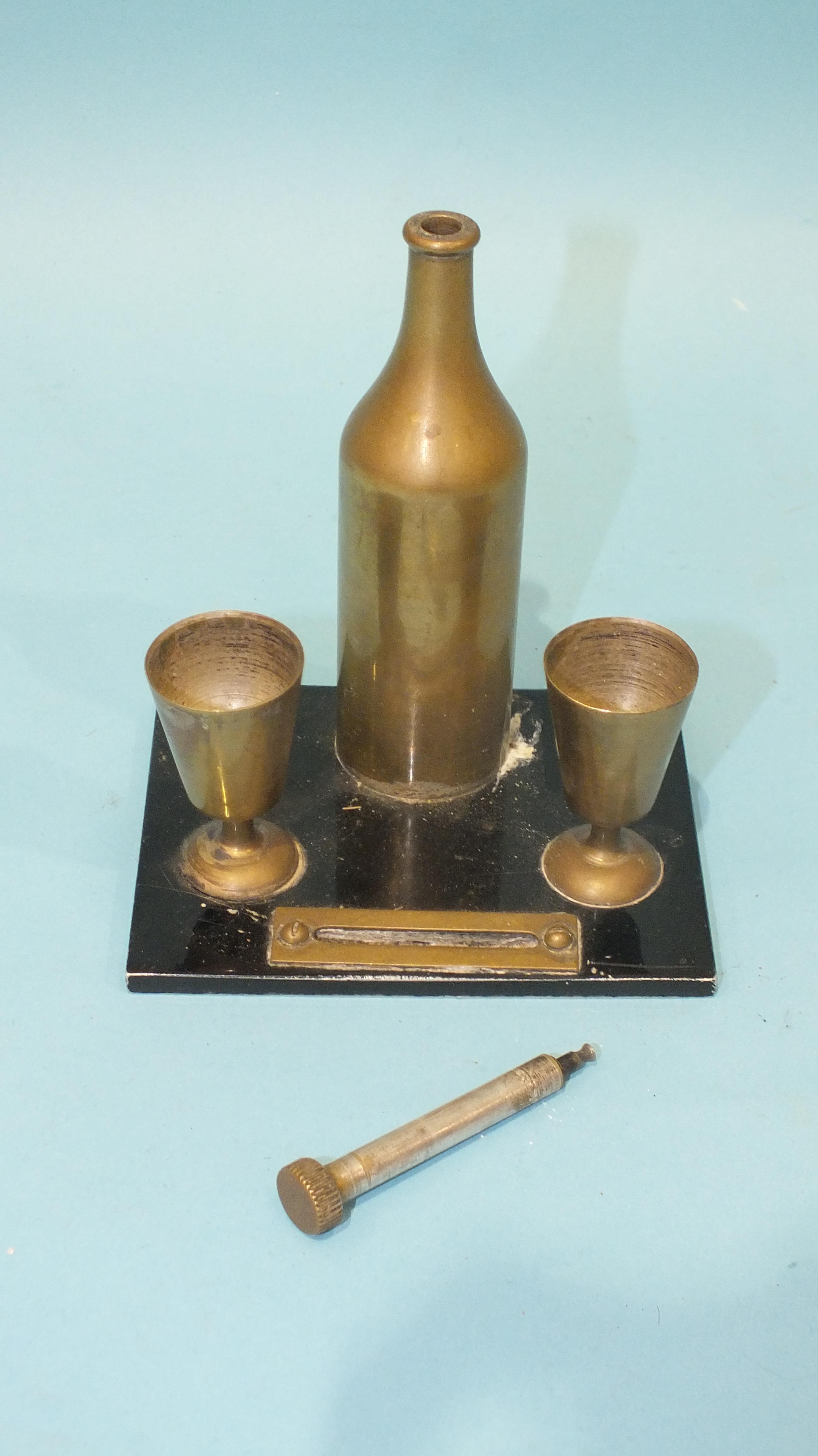 A small table match strike in the form of a brass bottle and two goblets, the bottle top pulling out - Image 2 of 2