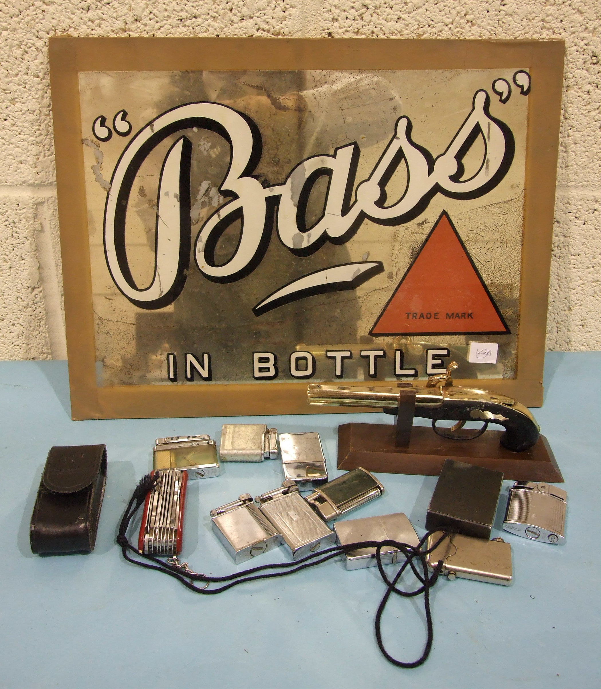 An unframed 'Bass in Bottle' advertising mirror, with red triangle trade mark, 33 x 43.3cm, some