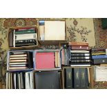 An accumulation of stamps and covers in albums, stock books and loose.