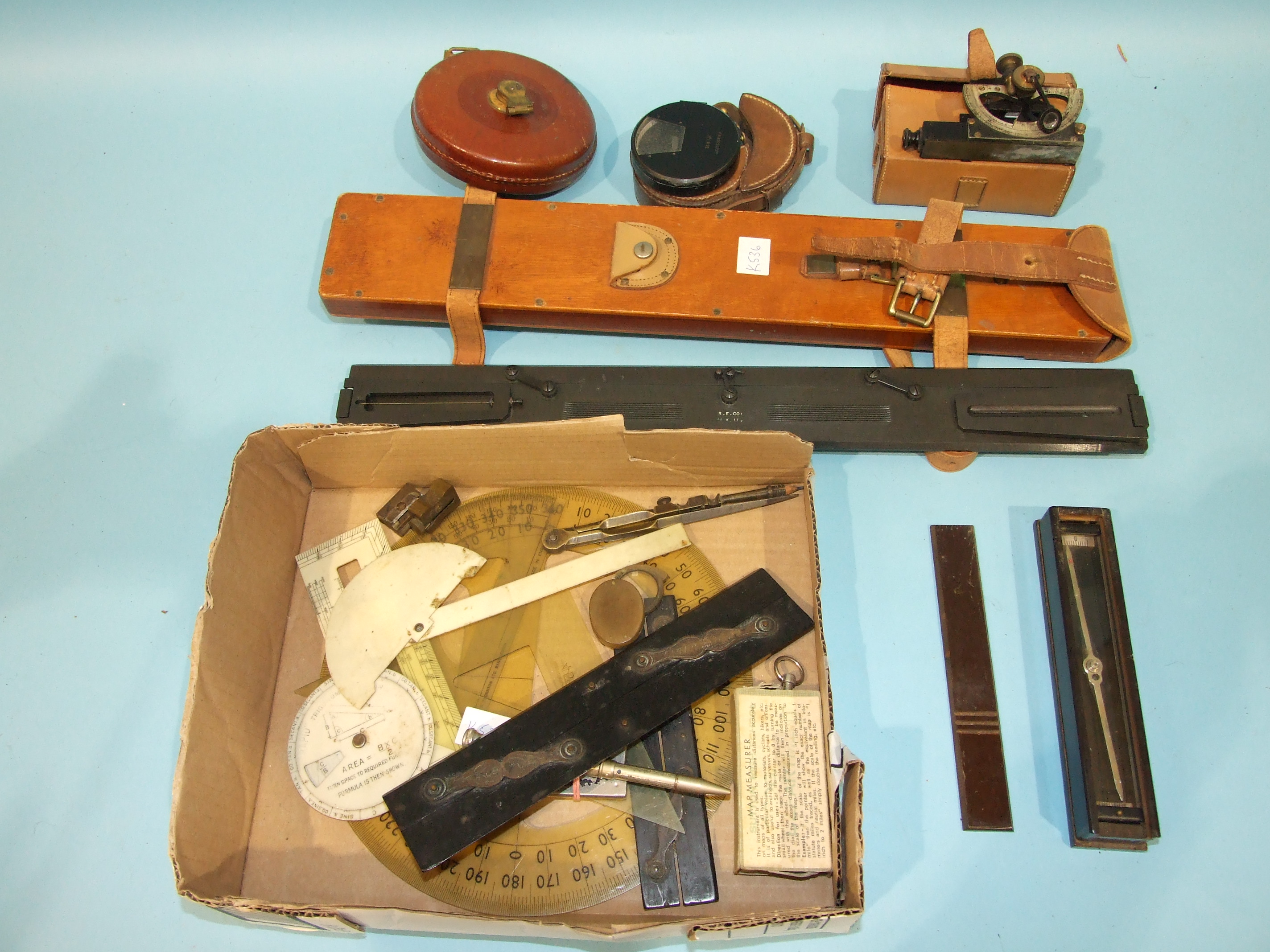 A military planometer, a JMG & Sons compass needle in Bakelite box, a clinometer and other