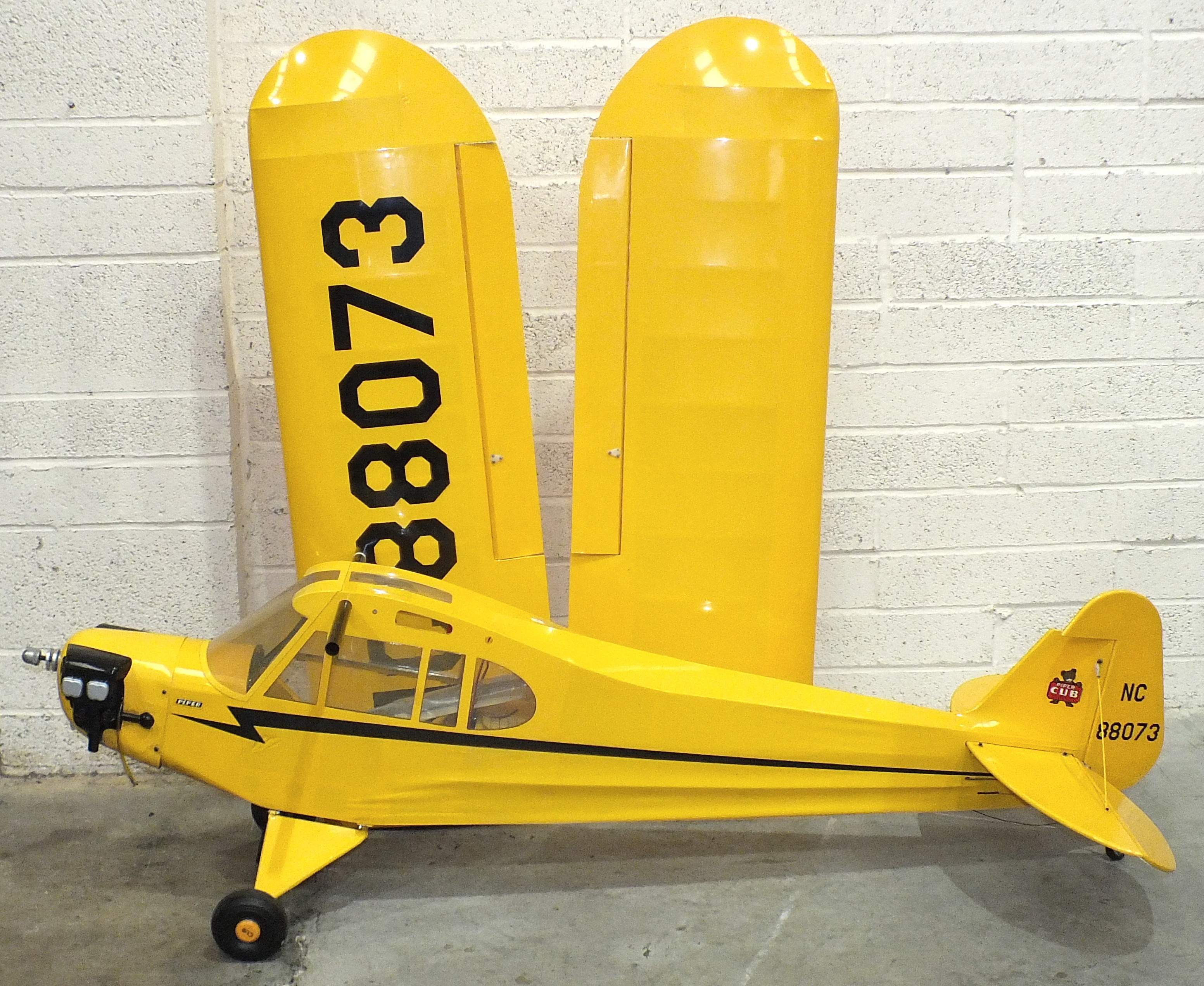 A Piper Cub ¼-scale remote-control aeroplane, complete with two XOAR propellers, (16x6, 16x8) and