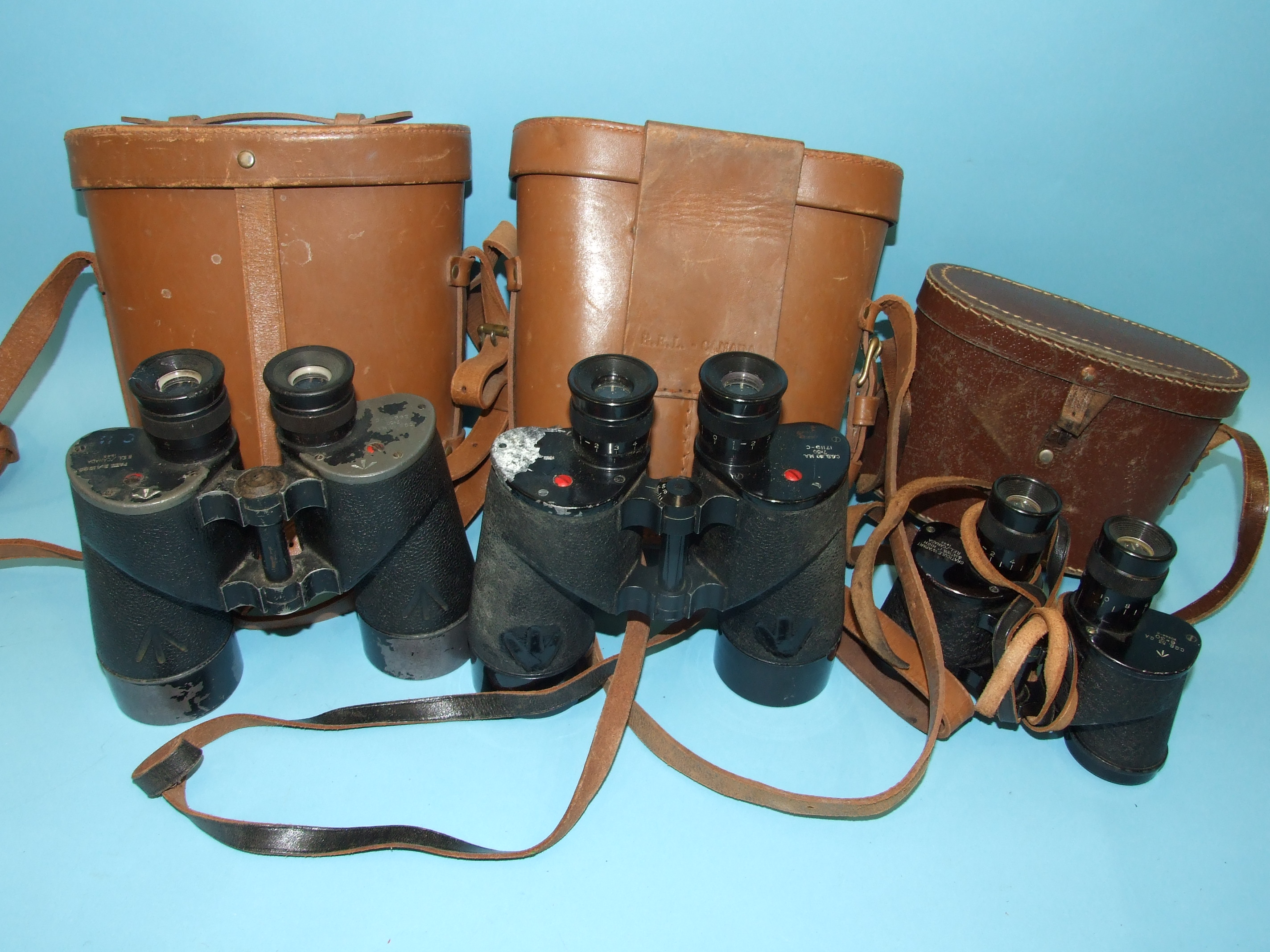 Two pairs of military binoculars by REL Canada, 1945, 7 x 50, cased and another, 6 x 30, 1943, in