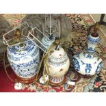 A collection of four modern Oriental decorated ceramic table lamps.