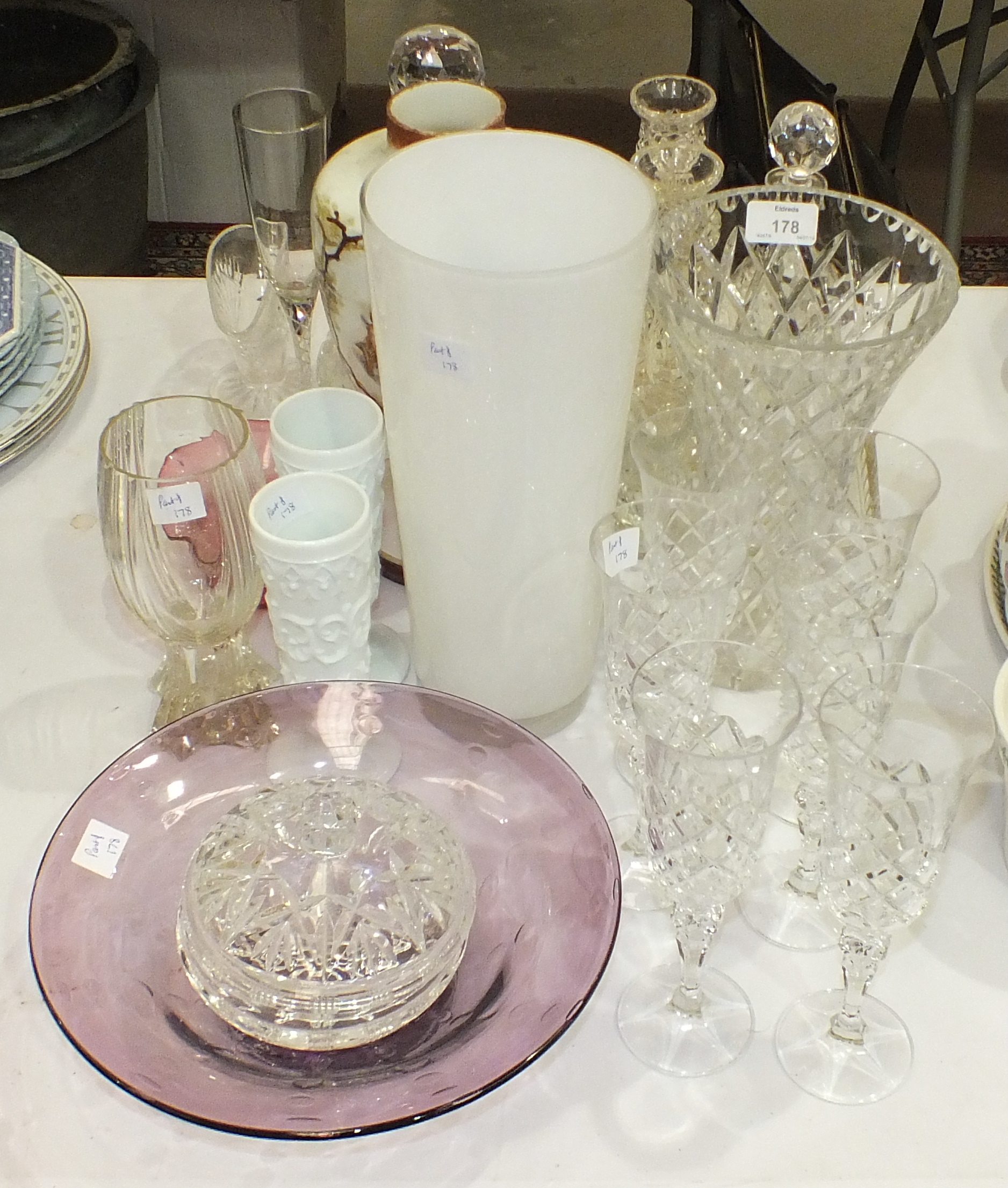 A collection of various glassware, including drinking glasses, decanters, vases, bowls, etc.