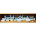 A collection of modern Wedgwood blue and white jasperware trinket items, including boxes, vases, pin