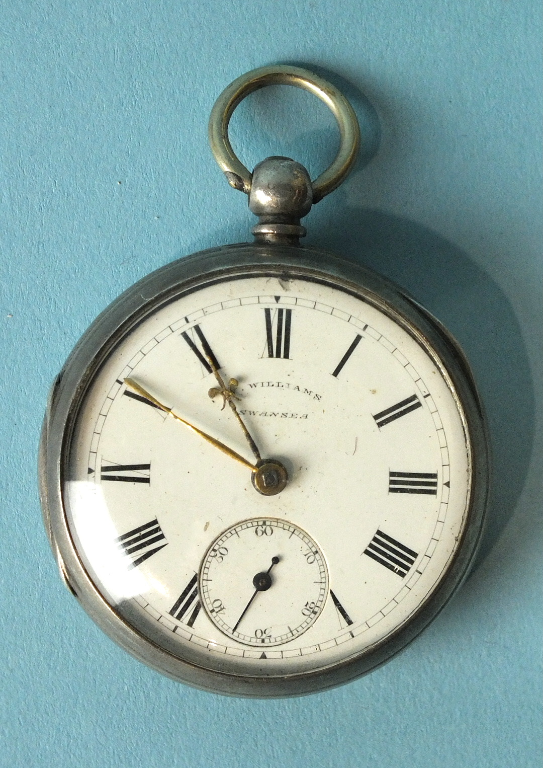 A Victorian silver-cased pocket watch, the white enamel dial marked 'W Williams, Swansea', with