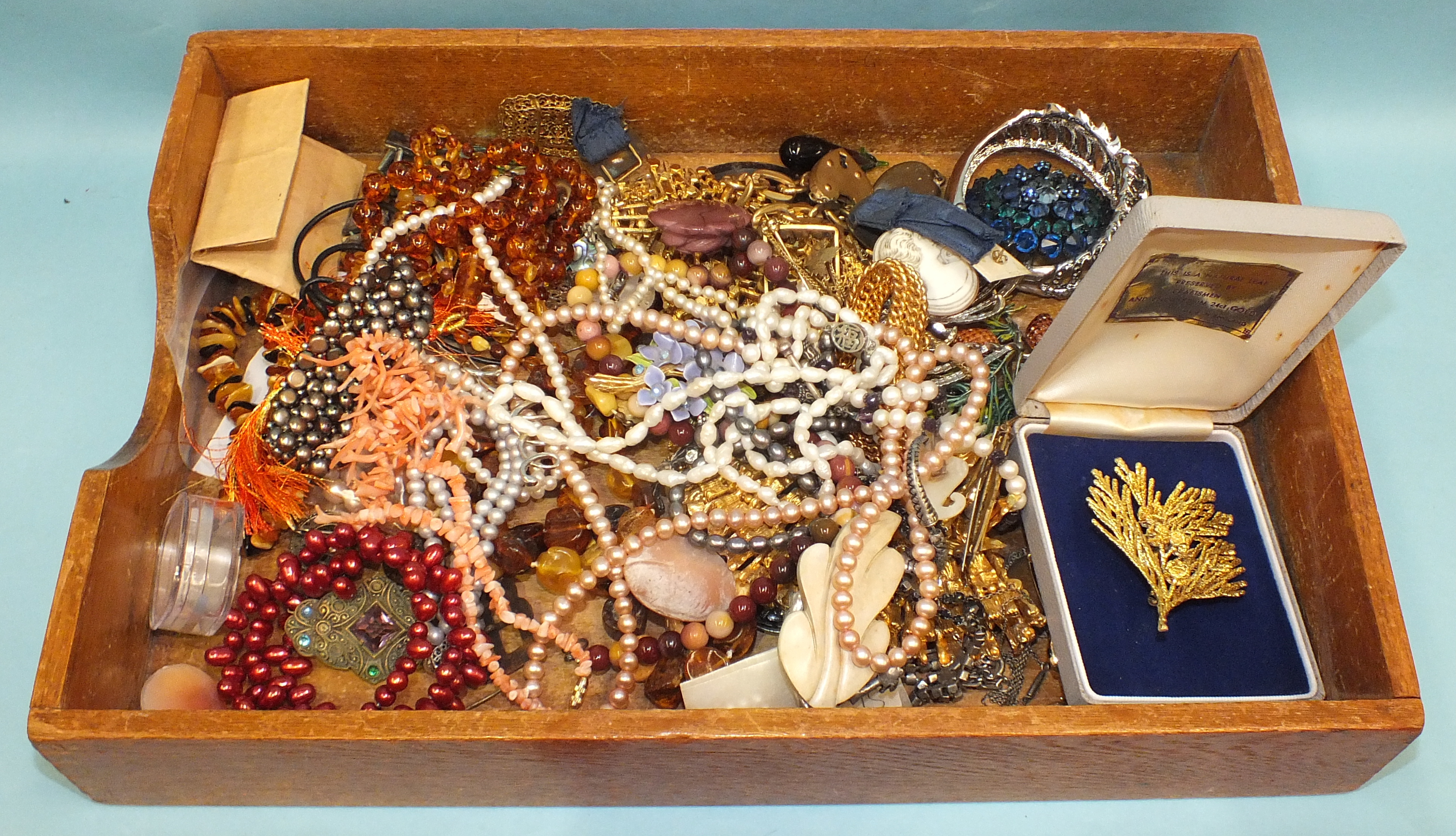 A quantity of costume jewellery, cultured pearl necklaces, amber beads, etc.