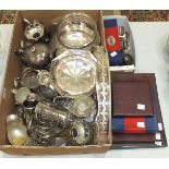 A collection of loose and cased cutlery, an oval tray and other plated ware.