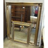 A large modern gilt-framed mirror, 91 x 117cm and a smaller gilt-framed mirror, (2).