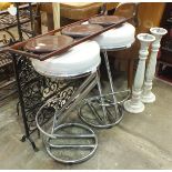 A mahogany three-tier folding cake stand, a pair of modern chrome-framed breakfast bar stools and