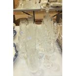 A part-suite of cut-glass drinking glasses, including six Champagne flutes, six small brandy, four