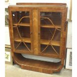 A 1930's walnut-veneered display cabinet, 110cm wide, 130cm high.