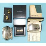 A Ronson table lighter with gadrooned decoration, a Ronson Varaflame lighter, boxed, a pair of