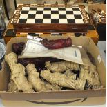 An American Express 'Reynard The Fox' composite chess set, (some damages), with a leather chess