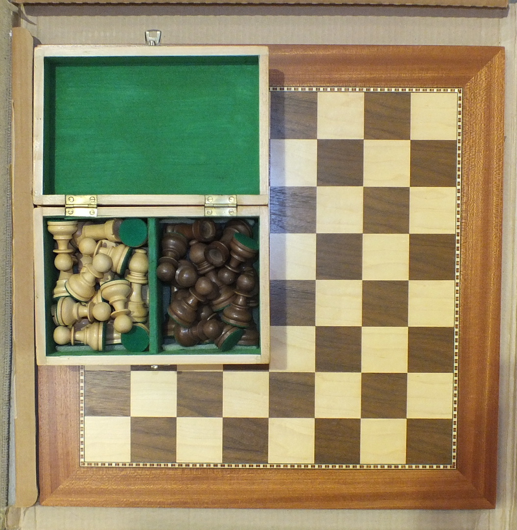 A modern Staunton-style chess set in box, a modern inlaid wooden chess board, 48.5cm square, a