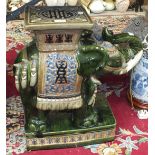 A modern Oriental ceramic elephant garden seat, 56cm high.