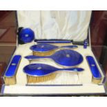 A Gieves Ltd blue enamel and silver dressing table set, cased, comprising hand mirror, two hair