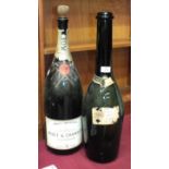 An empty Moët et Chandon Brut Imperial 600cl Champagne bottle, 58cm high and an empty 1955 Perrier-
