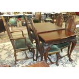 A set of five late-20th century walnut finish dining chairs with carved backs and upholstered seats,