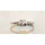 A solitaire diamond ring claw-set a brilliant-cut diamond, in 18ct white gold mount, size M, 2.5g.