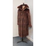 A lady's vintage musquash coat, a similar jacket and three fur stoles.