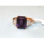 An amethyst and diamond ring, the emerald-cut amethyst claw-set between collet-set 8/8-cut diamond