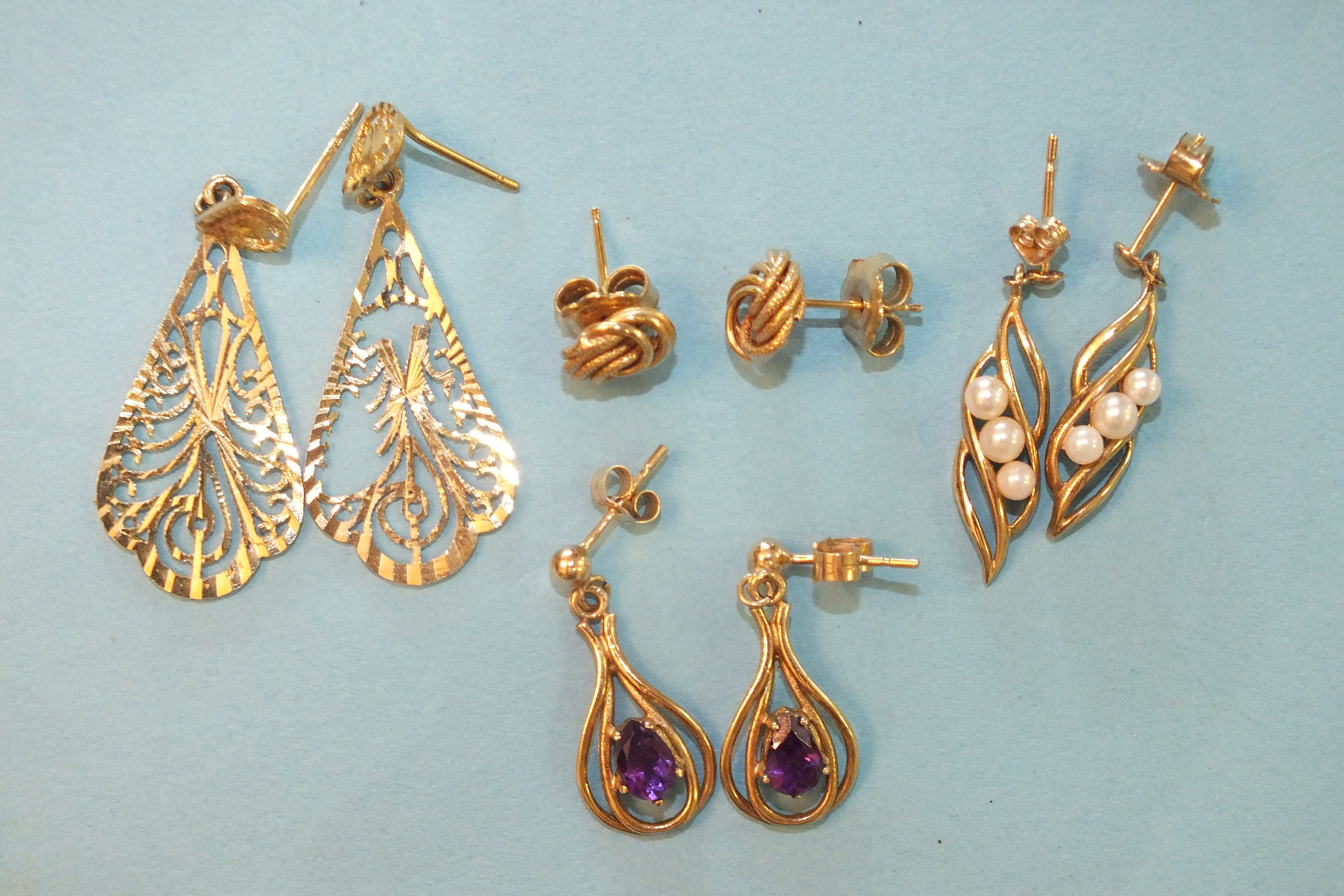 our pairs of 9ct gold earrings, 6.8g.