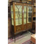 An Edwardian inlaid mahogany display cabinet, on cabriole legs, 124cm wide, 175cm high.