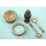 A miniature engine-turned silver egg, 3cm high with small treen egg cup, a silver napkin ring and