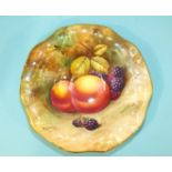 A 20th century Royal Worcester shaped circular shallow dish decorated with still life fruit,