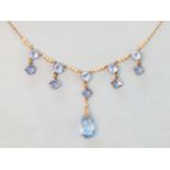 A blue paste and synthetic pearl fringe necklace with 9ct gold chain.
