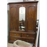 A Victorian mahogany two-door wardrobe, the base fitted with three drawers, 150cm wide, 220cm high.