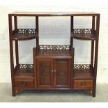 A modern Oriental hardwood side display cabinet fitted with gallery shelves, drawers and cupboard
