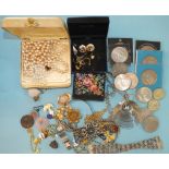 A quantity of costume jewellery and coins.