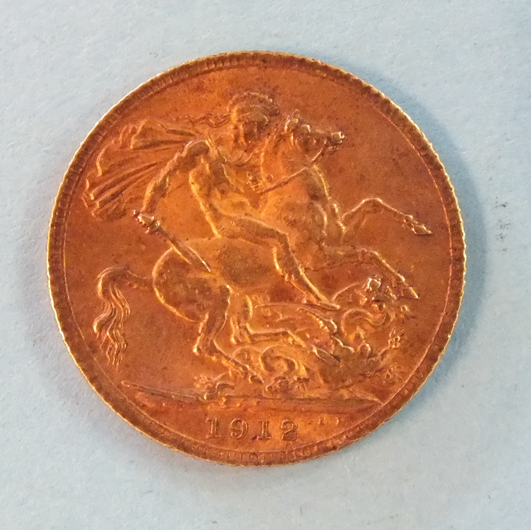 A George V 1912 gold sovereign.