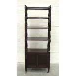 A mahogany five-tier whatnot, each tier supported on turned supports, above a two-door cupboard on