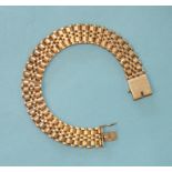 A 9ct gold brick-link bracelet, 12mm wide, 9cm long, 21.4g.