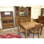 A suite of French Arts & Crafts dining room furniture, comprising a sideboard fitted with bevelled