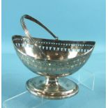 A George III Newcastle boat-shaped sugar basin with reeded swing handle and borders, the body having
