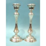 A pair of modern silver candlesticks with knopped stems and round bases, maker WI Broadway & Co,