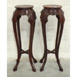 A pair of modern carved Oriental hardwood jardinière stands, 92cm high and a low coffee table fitted