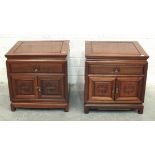 A pair of 20th century Oriental hardwood bedside cabinets, each fitted with a drawer and a pair of