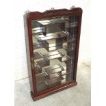 A modern Oriental hardwood glazed wall-mounted display cabinet, 84cm high, 48cm wide.