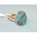 An 18ct yellow gold ring set oval black opal, size L, 2.5g.
